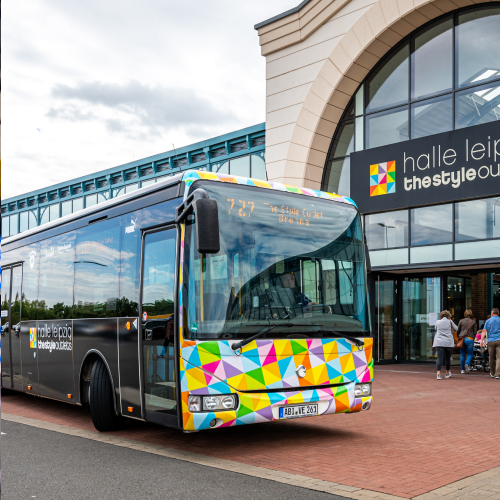 Shuttlebus for customers standing in front of our center