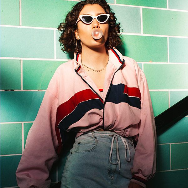 Woman makes chewing gum bubble